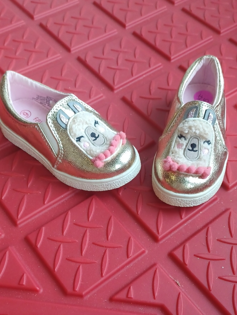 Falls Creek Metallic Gold Kids Slip-On Sneakers with Pink Llama Detail